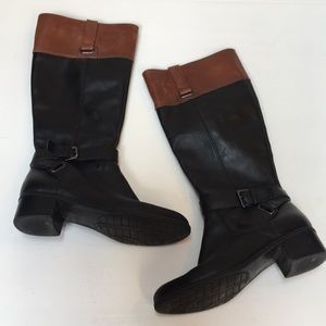 Black and brown knee height boots